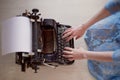 A creative person, author of books, writer of bestsellers,a journalist typing on an old typewriter. Inspiration in the Royalty Free Stock Photo