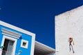 Creative perspective a modern blue and white single-story building wall on a clear sky