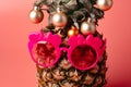 Creative pineapple with Christmas decorations on studio background