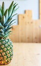 Creative pineapple on the light wooden background. Healthy eating fashion lifestyle concept. Copy space