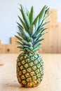 Creative pineapple on the light wooden background. Healthy eating fashion lifestyle concept. Copy space