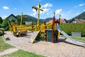 Pirate boat as play equipment on playground. Colorful wooden pirate boat With slide, climbing frame and suspension bridge