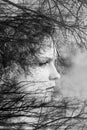 Creative portrait of beautiful young woman made from double exposure effect using photo of trees and nature Royalty Free Stock Photo