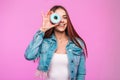 Creative portrait happy attractive young woman with donut near face on pink background in the studio. Beautiful positive woman in Royalty Free Stock Photo