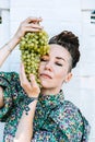 Creative portrait of vegan woman holding vegetables. Veganism, vegetarianism, plant-based diet