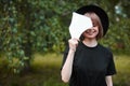 Creative portrait of A young beautiful modern millennial hipster girl in a hat black design with mirror, city Park Royalty Free Stock Photo