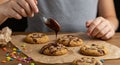 Creative process of child decorating cookies with chocolate. A creative food Royalty Free Stock Photo