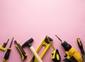 Creative provocation: a flat layout of yellow hand tools on a pink background.