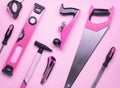 Creative provocation: a set of hand tools for construction and repair on a pink background. Royalty Free Stock Photo