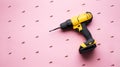 Creative provocation: a yellow screwdriver on a pink background and small screws. Royalty Free Stock Photo