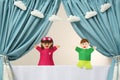 Creative puppet show on white stage indoors Royalty Free Stock Photo