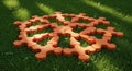 Creative Puzzle Pieces Forming Circular Pattern on Green Grass in Sunlight Royalty Free Stock Photo