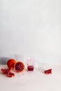 Creative realistic still life. Freshly squeezed orange juice in a crystal glass, whole orange and halves