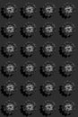 Creative regular seamless pattern of black succulent rosettes with hard shadows on black backdrop. Vertical orientation