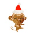 A creative retro cartoon of a suspicious monkey wearing santa hat