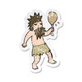 A creative retro distressed sticker of a cartoon cave man Royalty Free Stock Photo