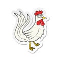 A creative retro distressed sticker of a cartoon cock