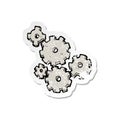 A creative retro distressed sticker of a cartoon cogs and gears Royalty Free Stock Photo