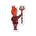 A creative retro distressed sticker of a cartoon devil with pitchfork Royalty Free Stock Photo