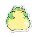 A creative retro distressed sticker of a cartoon fat toad Royalty Free Stock Photo