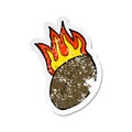 A creative retro distressed sticker of a cartoon flaming football