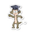 A creative retro distressed sticker of a cartoon graduate monkey