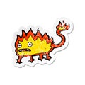 A creative retro distressed sticker of a cartoon little fire demon Royalty Free Stock Photo