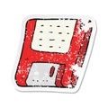 A creative retro distressed sticker of a cartoon old computer disk Royalty Free Stock Photo