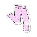 A creative retro distressed sticker of a cartoon pair of pink pants