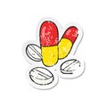 A creative retro distressed sticker of a cartoon pills