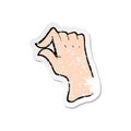 A creative retro distressed sticker of a cartoon pinching hand symbol