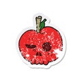 A creative retro distressed sticker of a cartoon poison apple