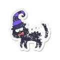 A creative retro distressed sticker of a cartoon scared black cat Royalty Free Stock Photo