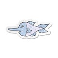 A creative retro distressed sticker of a cartoon swordfish