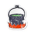 A creative retro distressed sticker of a cartoon witchs cauldron Royalty Free Stock Photo