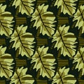 Creative seamless pattern with abstract monstera silouettes. Autumn print in black and pale green fall tones