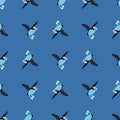 Creative seamless pattern with simple puffin bird silgouettes. Blue background. Biology zoo print