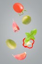 Creative seven pieces of flying fresh salad ingredients Royalty Free Stock Photo