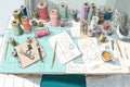 Creative Sewing Workspace With Colorful Threads, Sketches, and Tools in a Bright Setting Royalty Free Stock Photo
