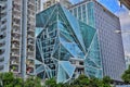 Creative shaped buildings in Shenzhen With green trees and blue sky background