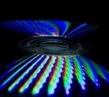 Creative shot of a CD back cover reflecting colorful bands on black background