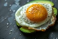 A creative shot of a fried egg on a slice of avocado, creating a vibrant contrast