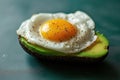 A creative shot of a fried egg on a slice of avocado, creating a vibrant contrast