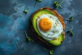 A creative shot of a fried egg on a slice of avocado, creating a vibrant contrast