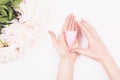 Menstrual cup in woman hands