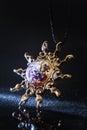 Creative shot of pendant sun made from brass and glass