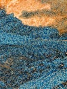 Creative shot of sand with blue paint at the beach