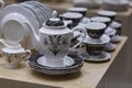 Creative shot of tea pot and White crockery for tea in shallow depth of field Royalty Free Stock Photo