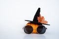 creative small pumpkin with witch hat and glasses