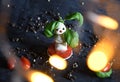 creative snowman canapes of mozzarella, tomatoes on a background of poinsettia